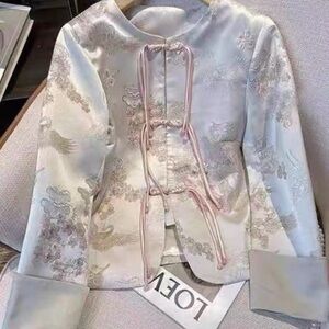 Elegant Embroidered Jacket with Pink Accents